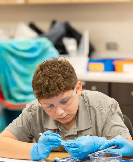 Middle School student conducting a science experiment