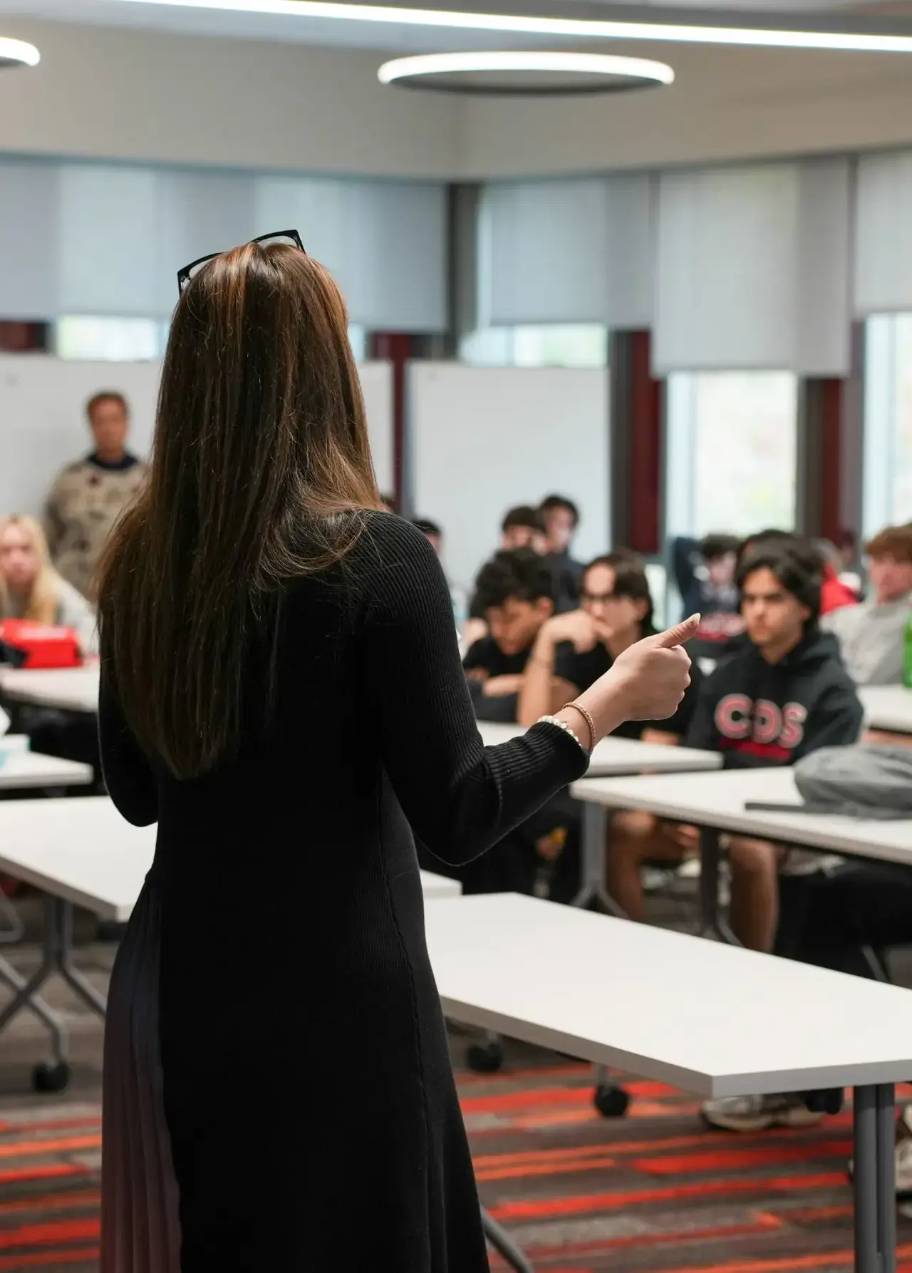 College counseling advisor speaking to upper school students