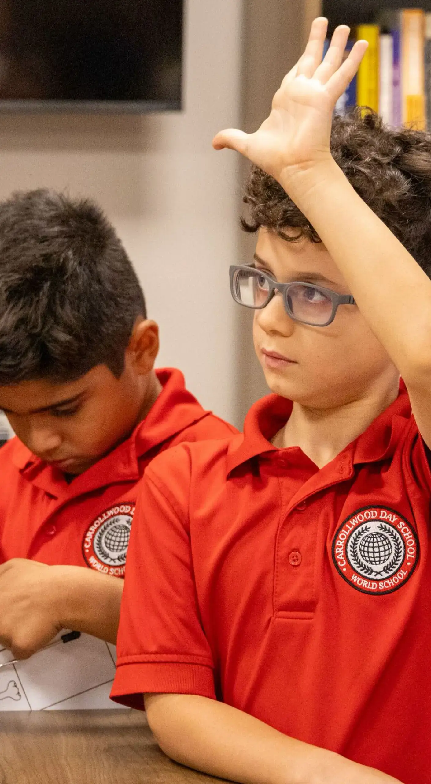 Lower School student raising hand