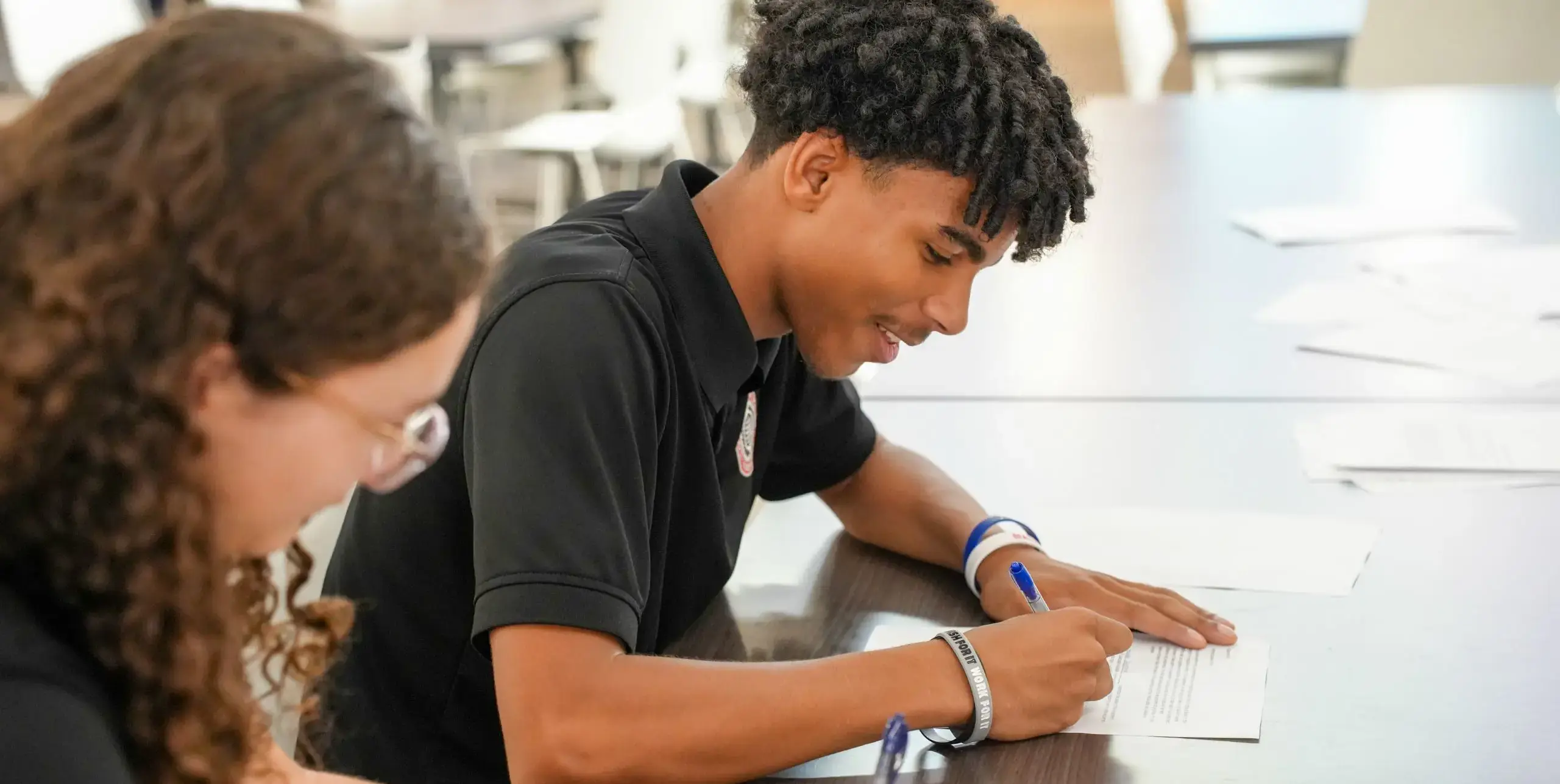 Upper school students studying