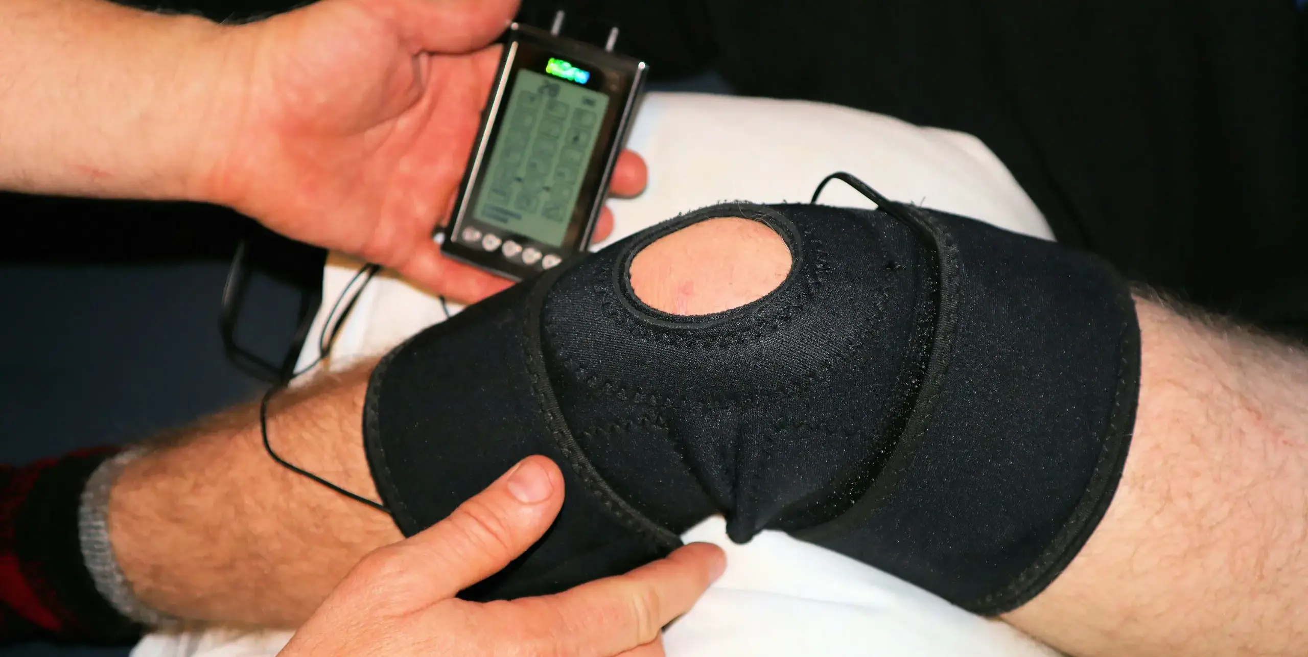 Trainer examining student